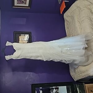 Never worn! White wedding gown from JJ's House.  Size 8